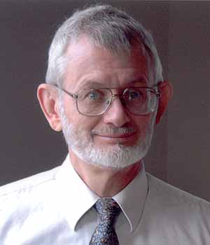 Portrait of web-page author David King (60 years old in this 2008 picture), with short, pale-gray hair and beard, wearing wire-frame eyeglasses, white shirt, and tie.